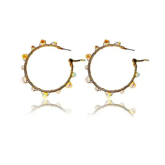 Golden hoop earrings transformed using Serinity beads in Opal White Shimmer and Brass Wire from Bluestreak Crystals